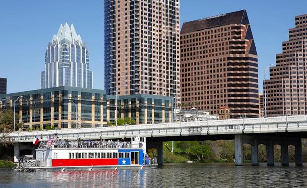a skyline view of Austin, Texas with a boat