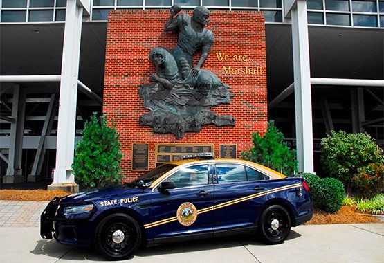 a West Virginia state police car outside of a police office
