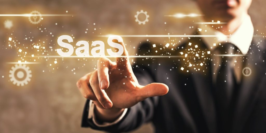 saas text with businessman on dark vintage background