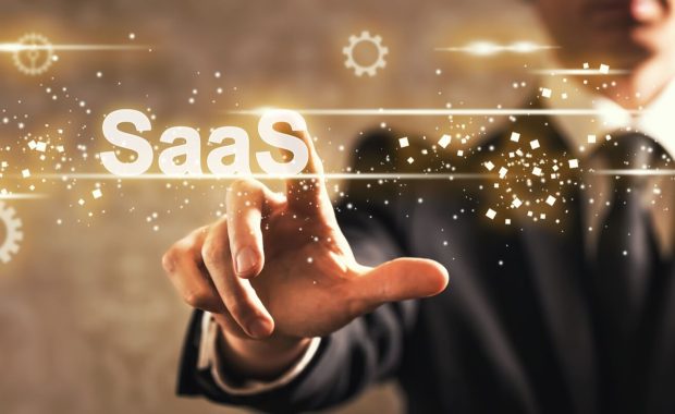 saas text with businessman on dark vintage background