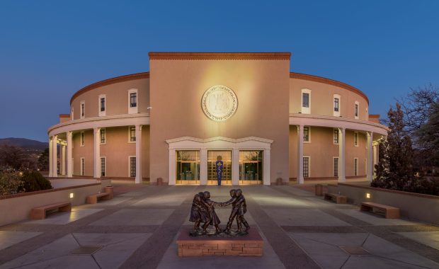 Exterior of the New Mexico State Capitol at night in Santa Fe, New Mexico