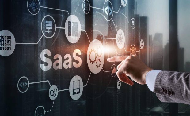 saas software as a service concept with man hand pressing text