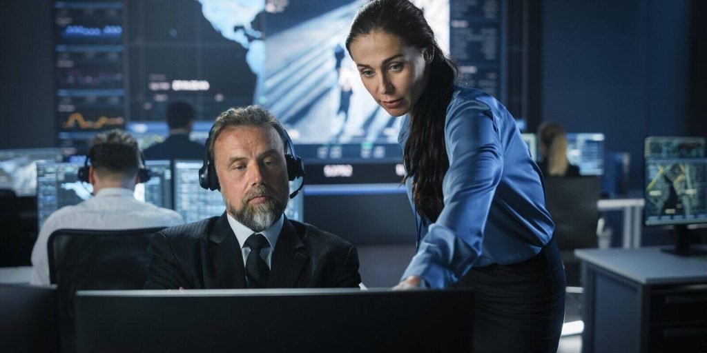 male and female government officers discuss working matters