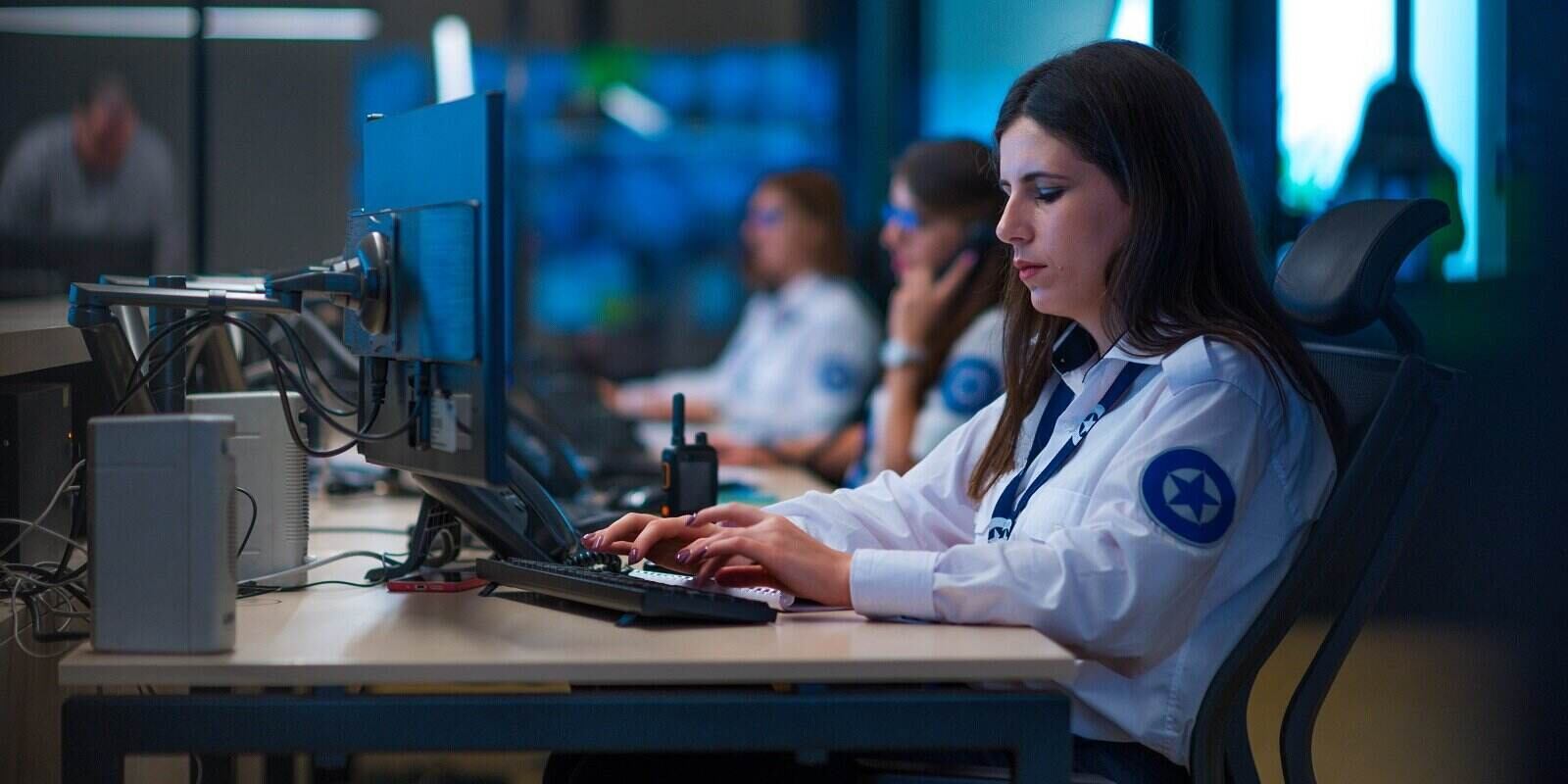 police officer working in computer system