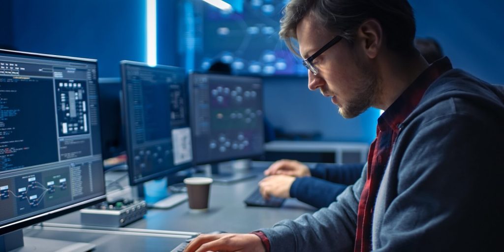 young professionals doing high tech coding