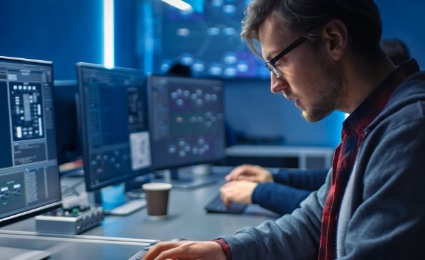 young professionals doing high tech coding