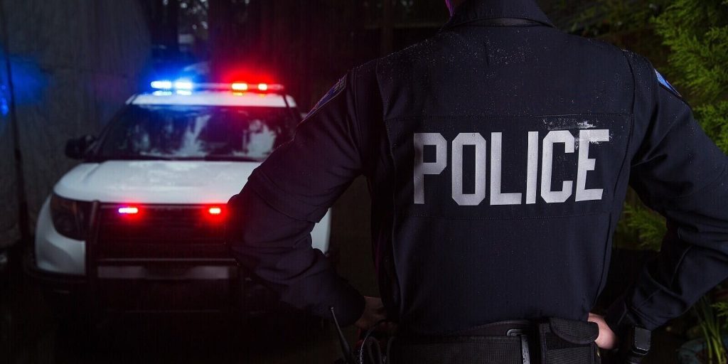 police officer near car