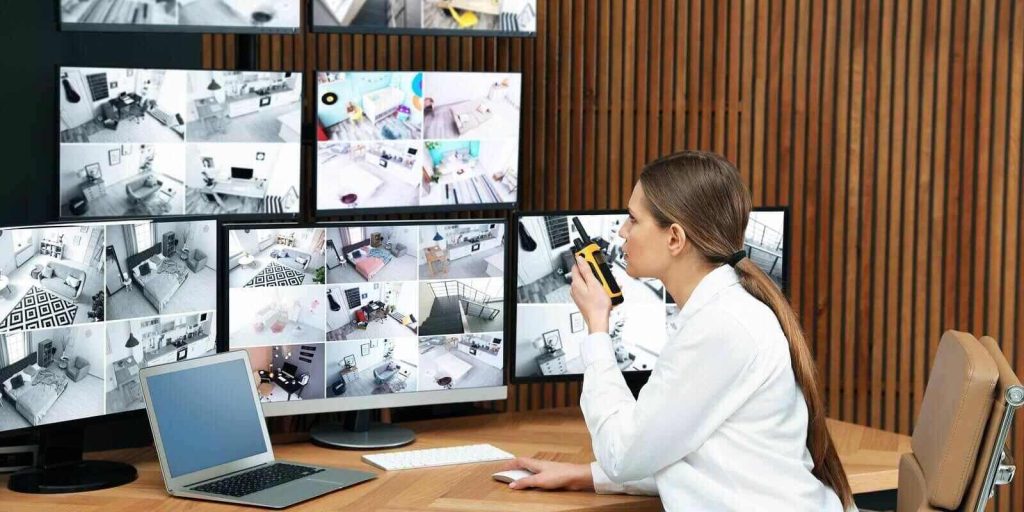 security guard using portable transmitter at workplace