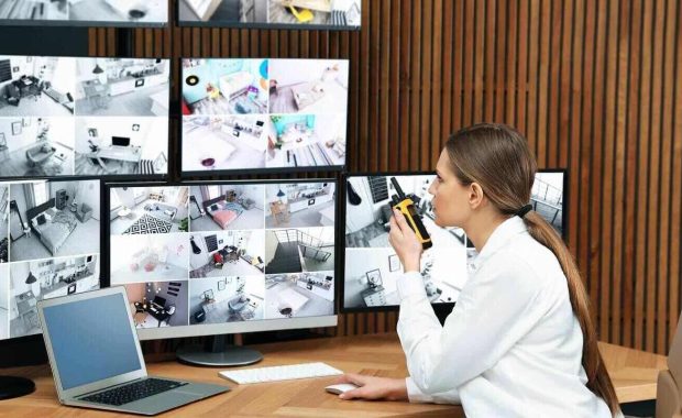 security guard using portable transmitter at workplace