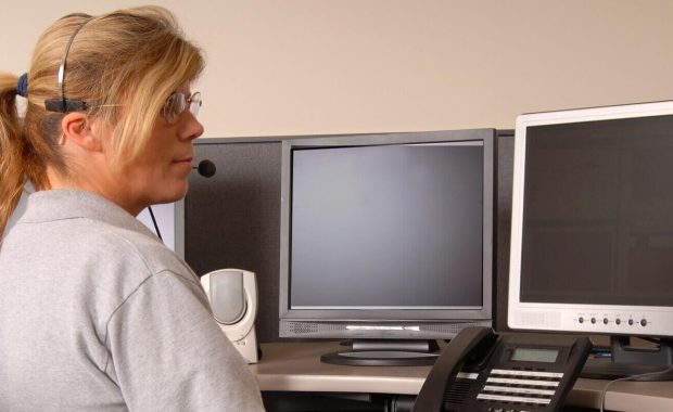 police dispatcher working at console