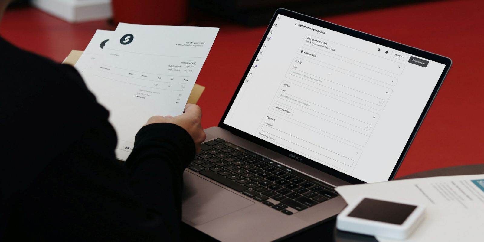 A Person Sitting with Laptop and Papers
