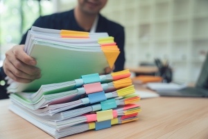 Businessman Handling Stack of Documents