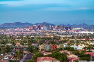 a view of downtown Phoenix, AZ with mountains in the background