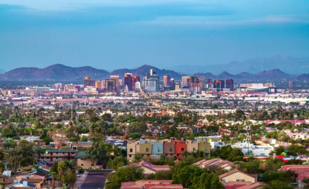 a view of downtown Phoenix, AZ with mountains in the background