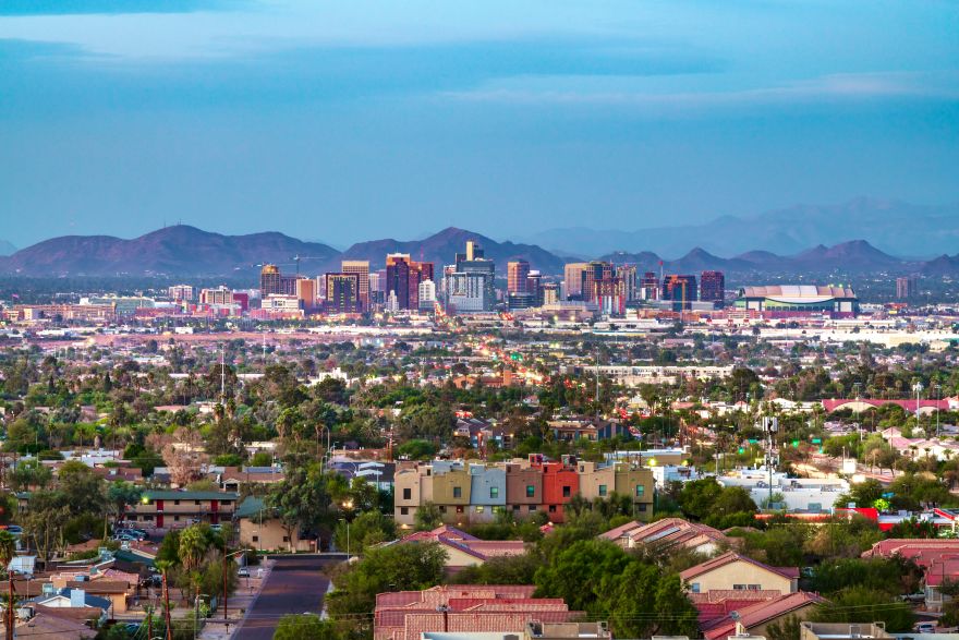 a view of downtown Phoenix, AZ with mountains in the background