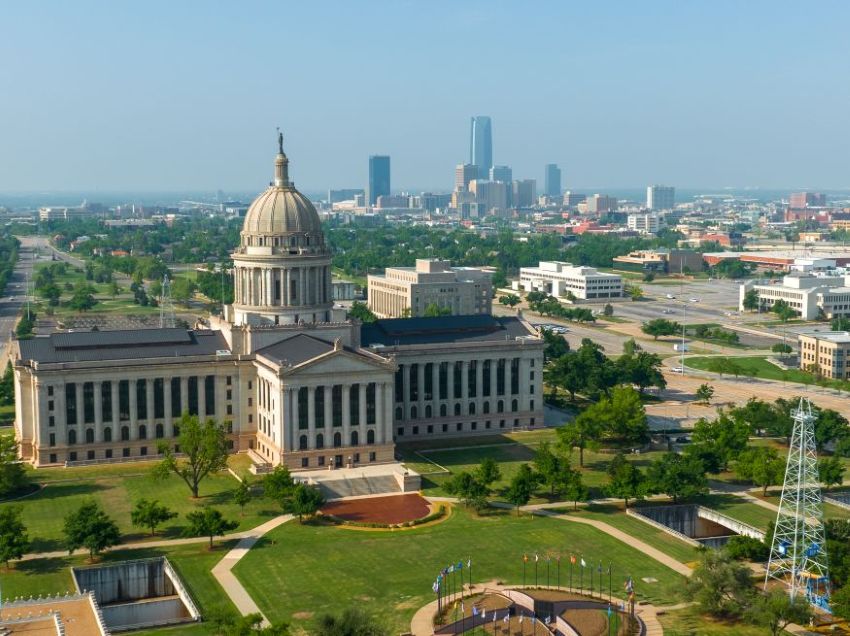 arial photo of the Oklahoma Capitol building with Oklahoma City in the background