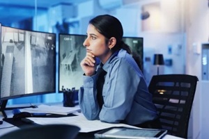 woman on monitor in control room for surveillance, investigation and protection service