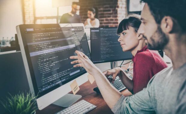 Developing programming and coding technologies. Website design. Programmer working in a software develop company office.
