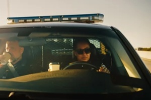 two police officers driving traffic patrol car