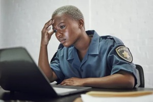 woman and headache from working with stress on computer or frustrated with case, report or anxiety in security.