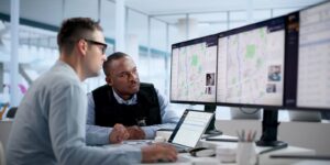 crime analyst studies crime patterns on laptop