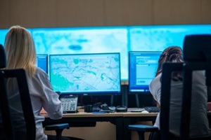 female security guards working in surveillance room