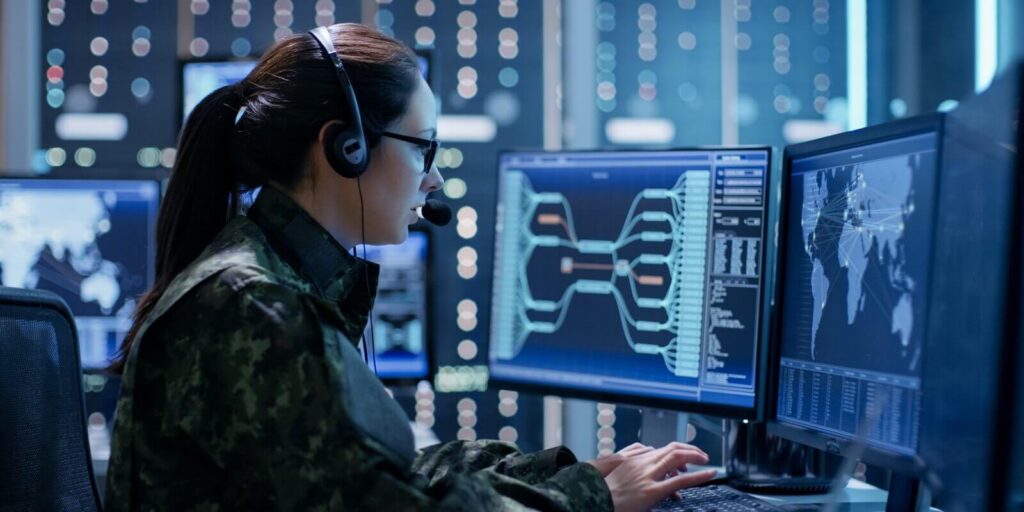 shot of female government agent tracking fugitive with her computer