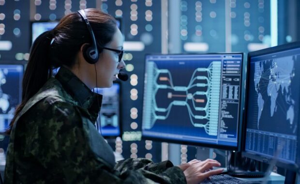 shot of female government agent tracking fugitive with her computer