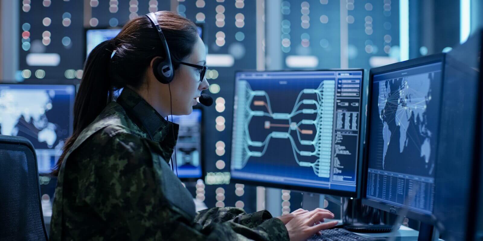 shot of female government agent tracking fugitive with her computer